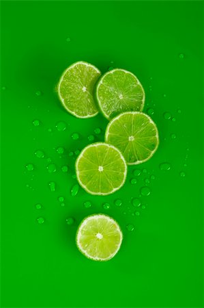 simsearch:400-05057164,k - Lime and drop on green, form of question symbol Fotografie stock - Microstock e Abbonamento, Codice: 400-04567660