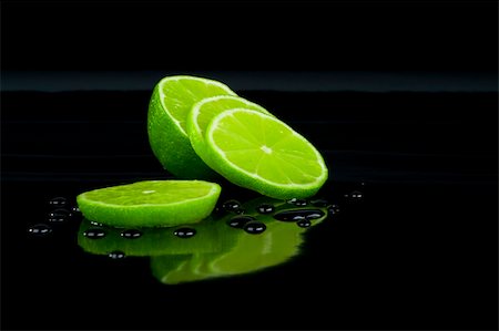 Lime on black and drops Stock Photo - Budget Royalty-Free & Subscription, Code: 400-04567663