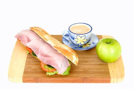 piccolo - French bread with ham and cheese on cutting board with coffee and apple Stock Photo - Budget Royalty-Free & Subscription, Code: 400-04568004