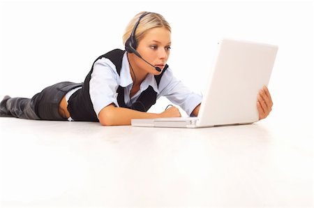 simsearch:400-05729276,k - Businesswoman working on her laptop while lying down on the floor Stock Photo - Budget Royalty-Free & Subscription, Code: 400-04568115