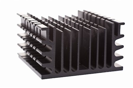 Close up on a computer component: a black heat sink, which dissaptes heat from the processor to keep the computer from melting. Photographie de stock - Aubaine LD & Abonnement, Code: 400-04568259
