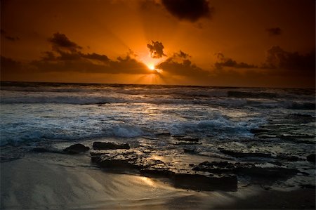 beautiful sunset at the beach Fotografie stock - Microstock e Abbonamento, Codice: 400-04568555