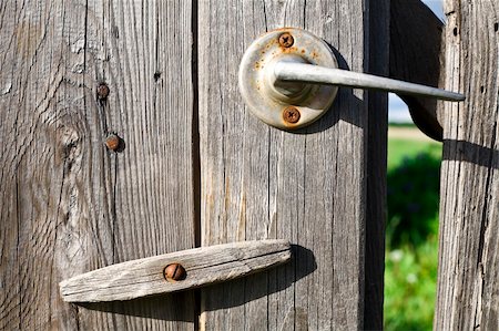 simsearch:400-07924258,k - Old Wooden Door With Rusty Lock Stock Photo - Budget Royalty-Free & Subscription, Code: 400-04568729