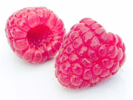 A fresh raspberries over white background Stockbilder - Microstock & Abonnement, Bildnummer: 400-04568937