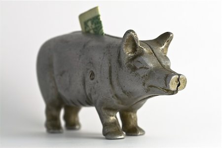 piggy bank vintage photograph - Antique cast iron metal piggy bank with a one dollar bill. Stock Photo - Budget Royalty-Free & Subscription, Code: 400-04568956