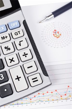 simsearch:400-03962284,k - Calculator and pen on earnings chart background. Shallow depth of field Stock Photo - Budget Royalty-Free & Subscription, Code: 400-04569099
