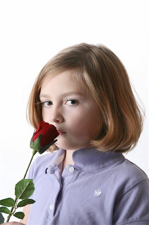 sparkmom (artist) - Pretty girl smelling single red rose against high key background. Foto de stock - Super Valor sin royalties y Suscripción, Código: 400-04569467