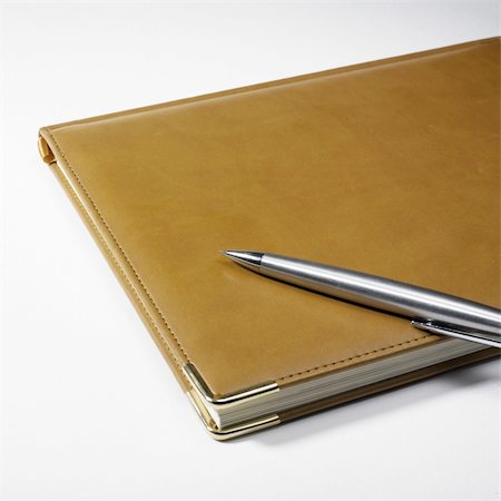 simsearch:400-04778374,k - Planner and pen isolated on a white background Foto de stock - Super Valor sin royalties y Suscripción, Código: 400-04569539