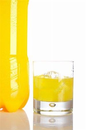 simsearch:400-05148141,k - Bottle and glass of orange soda with droplets reflected on white background Stockbilder - Microstock & Abonnement, Bildnummer: 400-04569577