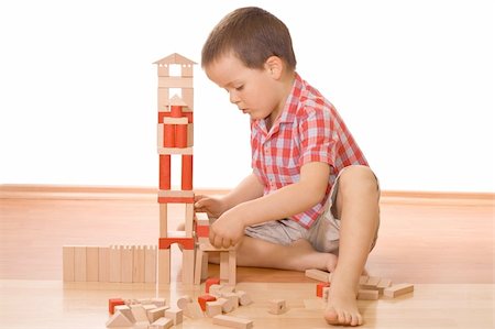 simsearch:400-04161270,k - Little boy playing with wooden blocks - isolated Foto de stock - Super Valor sin royalties y Suscripción, Código: 400-04569746