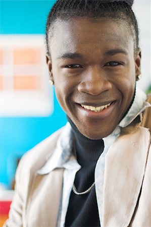 Portrait of an african american man smiling. Shallow DOF. Photographie de stock - Aubaine LD & Abonnement, Code: 400-04569810