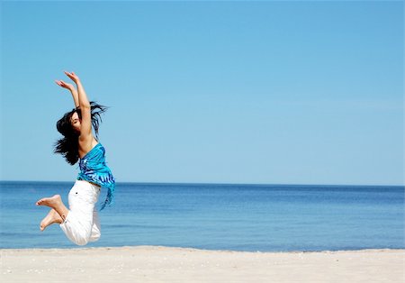 simsearch:400-04123668,k - attractive woman jumping on the beach Stock Photo - Budget Royalty-Free & Subscription, Code: 400-04561012