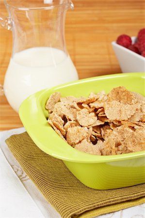 simsearch:400-03917186,k - A bowl of cornflakes, milk and raspberries on bamboo mat Stock Photo - Budget Royalty-Free & Subscription, Code: 400-04561178