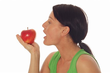 woman with apple on white background Stock Photo - Budget Royalty-Free & Subscription, Code: 400-04561205