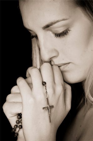 simsearch:400-04178541,k - Young female prayer with rosary in sepia. Photographie de stock - Aubaine LD & Abonnement, Code: 400-04561254