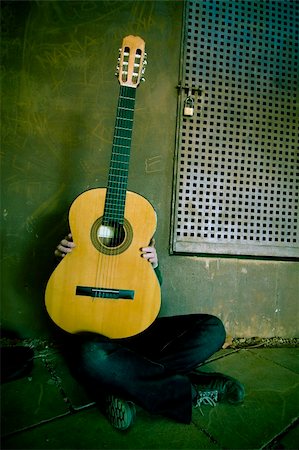 photographic portraits poor people - Young guitar performer behind the instrument. Cross processed. Stock Photo - Budget Royalty-Free & Subscription, Code: 400-04561251
