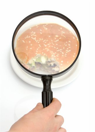 person inspecting a hamburger with a magnifying glass Stock Photo - Budget Royalty-Free & Subscription, Code: 400-04561953
