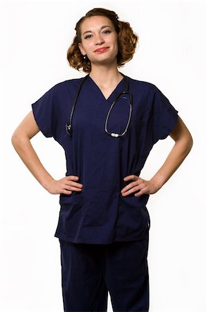 simsearch:400-03995908,k - Attractive young brunette woman health care worker standing with a smiling friendly expression over white Stock Photo - Budget Royalty-Free & Subscription, Code: 400-04562077