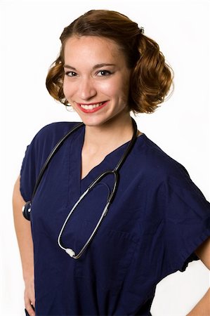 simsearch:400-05172792,k - Attractive young brunette woman health care worker standing with a smiling friendly expression over white Foto de stock - Royalty-Free Super Valor e Assinatura, Número: 400-04562078