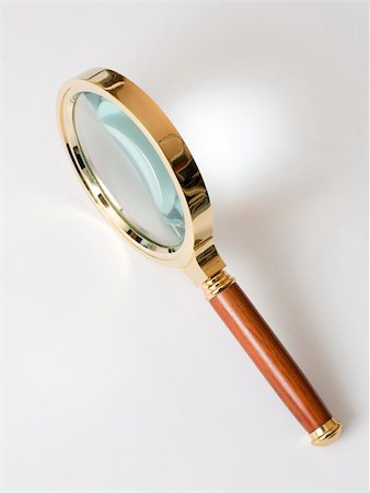 simsearch:400-04996978,k - Magnifier in brass frame with a wooden handle. Photographie de stock - Aubaine LD & Abonnement, Code: 400-04562166