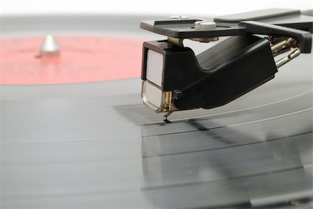 The needle of an old player scratches a vinyl disk Stockbilder - Microstock & Abonnement, Bildnummer: 400-04562183