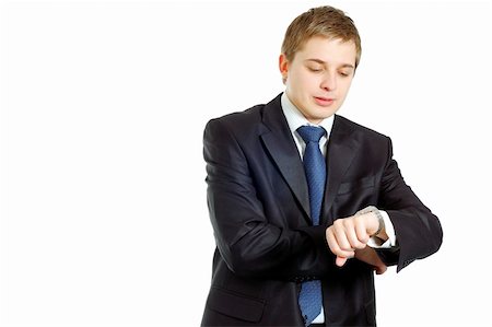 handsome businessman checking his wrist-watch Stock Photo - Budget Royalty-Free & Subscription, Code: 400-04562209