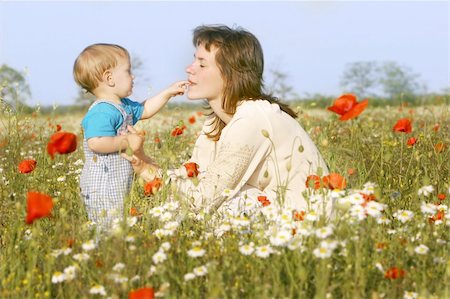everyday family - mother and son playing in flowers Stock Photo - Budget Royalty-Free & Subscription, Code: 400-04562847