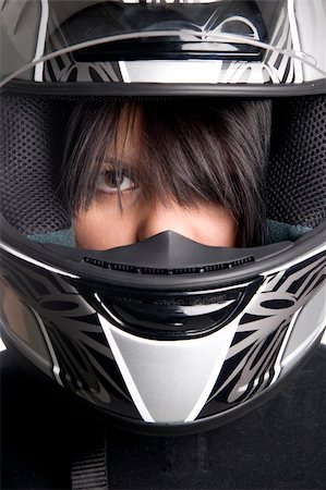 young attractive woman in big motorcycle helmet Stock Photo - Budget Royalty-Free & Subscription, Code: 400-04562850