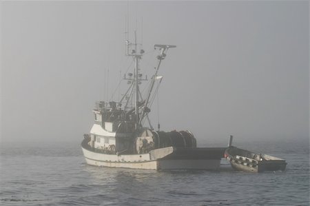 seine maritime - A fishing boat disappearing into the fog in Puget Sound. The mist has shrouded this boat with a little bit of mystery. Stock Photo - Budget Royalty-Free & Subscription, Code: 400-04562886