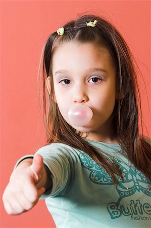 Young girl enjoying a bubble gum Stock Photo - Budget Royalty-Free & Subscription, Code: 400-04563882