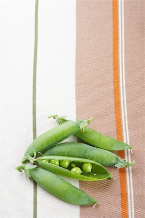sweetpea - fresh green peas on tablecloth background Stock Photo - Budget Royalty-Free & Subscription, Code: 400-04574166