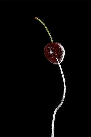 wet cherry with fork over black background, refined curves design Foto de stock - Royalty-Free Super Valor e Assinatura, Número: 400-04574172