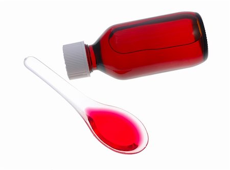 Spoon of cough medicine and bottle in isolated white background Foto de stock - Super Valor sin royalties y Suscripción, Código: 400-04574674