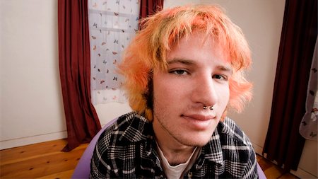 simsearch:400-06330521,k - Closeup of a Young man with Bright Hair in a Bare Room Photographie de stock - Aubaine LD & Abonnement, Code: 400-04574805