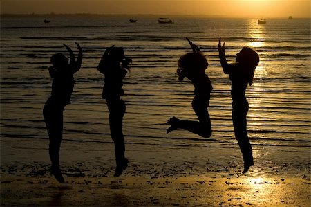 A silhouette of girls jumping in water. Stock Photo - Budget Royalty-Free & Subscription, Code: 400-04574939