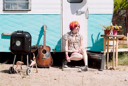 flamingo not pink not bird - Punk girl with brightly colored hair sitting on a trailer step Stock Photo - Budget Royalty-Free & Subscription, Code: 400-04575066