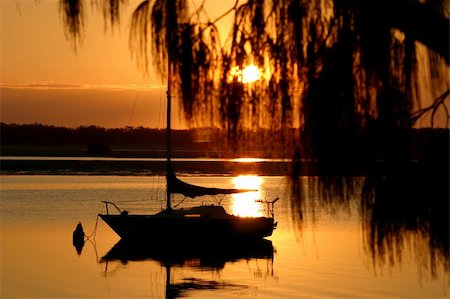 simsearch:400-05255037,k - Yacht bathed in early morning golden light. Stock Photo - Budget Royalty-Free & Subscription, Code: 400-04575316