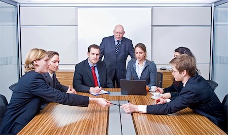 Seven people in a cubicle, preparing for a management team meeting Stock Photo - Budget Royalty-Free & Subscription, Code: 400-04575464