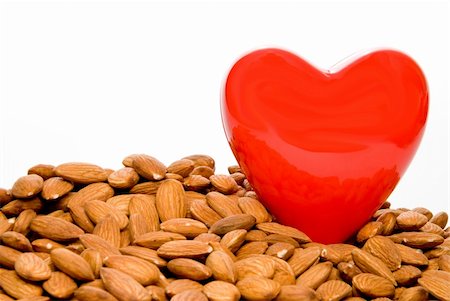 A heart surrounded by cholesterol busting almonds. Stock Photo - Budget Royalty-Free & Subscription, Code: 400-04575605