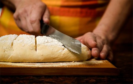 serrated - Adding cut to unbaked bread dough with serrated knife Stock Photo - Budget Royalty-Free & Subscription, Code: 400-04575684