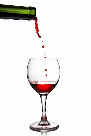 simsearch:6113-06497986,k - Pouring red wine in goblet isolated on white Stockbilder - Microstock & Abonnement, Bildnummer: 400-04575796