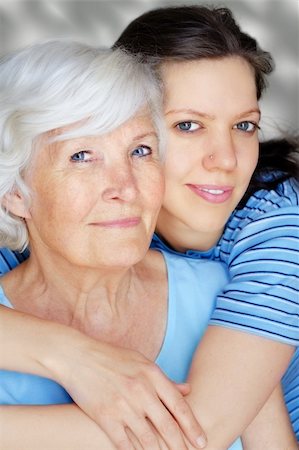 Grandmother and granddaughter embraced with blue shirts Stock Photo - Budget Royalty-Free & Subscription, Code: 400-04576270