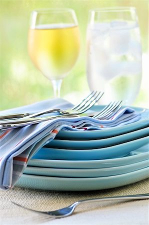 simsearch:400-05178995,k - Table setting with stack of plates and cutlery Stock Photo - Budget Royalty-Free & Subscription, Code: 400-04576386