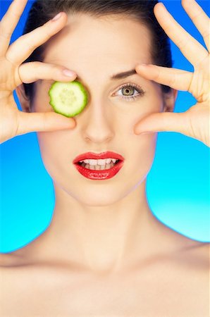 simsearch:400-04083912,k - Portrait of beautiful woman with cucumber slice Stock Photo - Budget Royalty-Free & Subscription, Code: 400-04576453