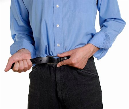 Conceptual shot of business man tightening his belt during tough economic times Foto de stock - Super Valor sin royalties y Suscripción, Código: 400-04577025