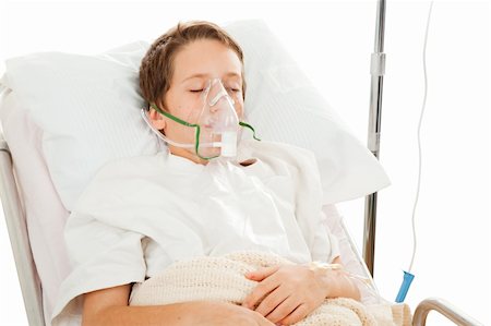 patient on bed and iv - Little boy in the hospital breathing with the help of a respirator.  Isolated on white. Stock Photo - Budget Royalty-Free & Subscription, Code: 400-04577028