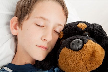 Closeup of adorable little boy sound asleep with his stuffed animal. Stock Photo - Budget Royalty-Free & Subscription, Code: 400-04577033