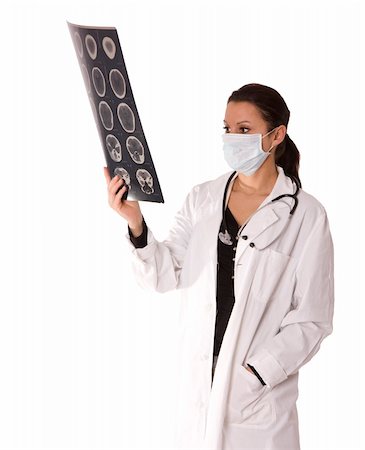 simsearch:400-04508758,k - female doctor in medical mask looking at xray. Foto de stock - Super Valor sin royalties y Suscripción, Código: 400-04577158