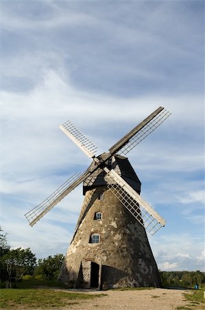 dutch farm architecture - Traditional Old dutch windmill in Latvia against blue sky with white clouds Stock Photo - Budget Royalty-Free & Subscription, Code: 400-04577864