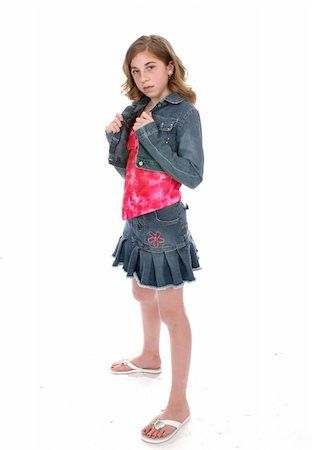 short skirt for kids - Defiant looking young girl wearing a short denim mini skirt and a cropped denim jacket. Stock Photo - Budget Royalty-Free & Subscription, Code: 400-04570764